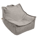 Miękki fotelik dla dziecka boucle w kolorze beige do pokoju dziecięcego