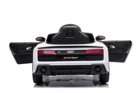 Audi R8 na akumulator dla dziecka w kolorze białym – profil boczny samochodu elektrycznego.