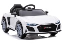 Białe Audi R8 na akumulator dla dzieci – sportowy samochód elektryczny z dużymi kołami i światłami LED.