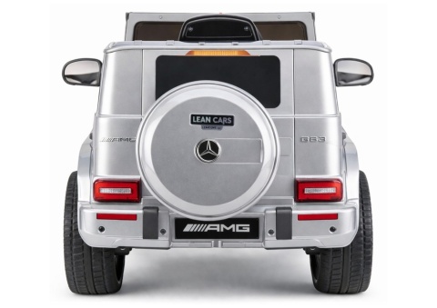 Tył samochodu Mercedes AMG G63 na akumulator dla dzieci w kolorze srebrnym z kołem zapasowym.