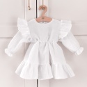 Biała muślinowa sukienka dla dziewczynki z falbankami i długim rękawem. Elegancka sukienka dziecięca handmade.